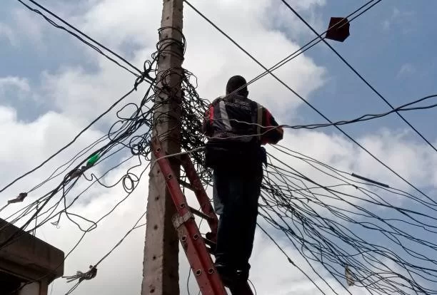Eletricity-pole GistReel NERC threatens fine for Nigerians caught doing illegal connection, meter bypass