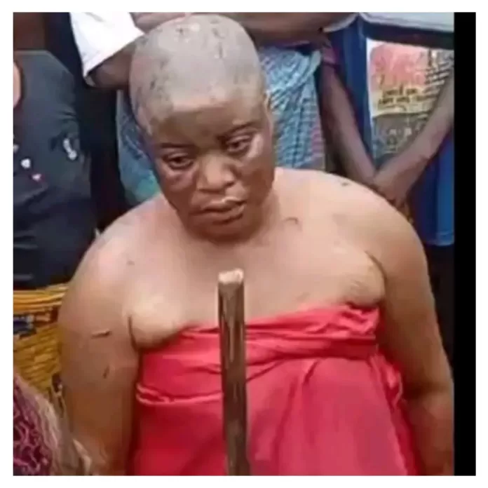 Community parades ex-monarch’s wife allegedly caught burying charms